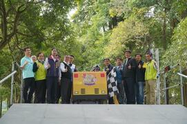 Group photo of distinguished guests at starting block