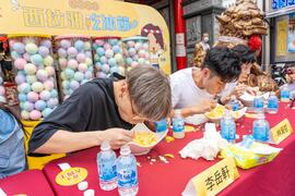 Gurgitators tried their best to eat mango shaved ice.